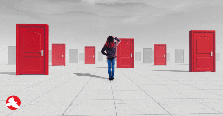 Executive standing at a decision point facing multiple paths after a product prototype