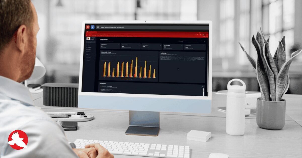 Engineer reviewing the Red Hawk SCA dashboard with vulnerability trends and remediation workflows
